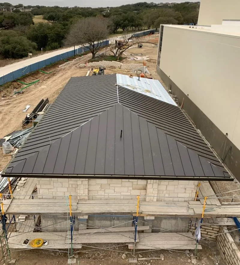 Metal roof new construction with scaffolding in Tolleson